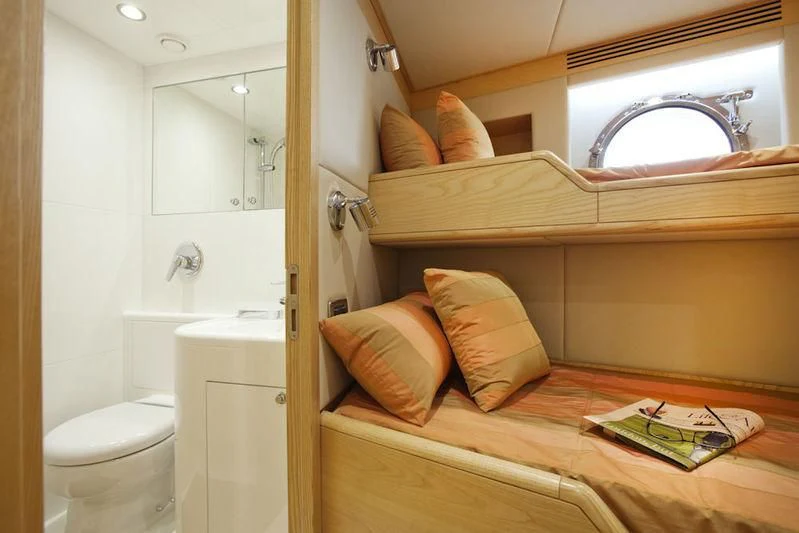 a bathroom with a bed and a mirror aboard GRAND CRU Yacht for Sale