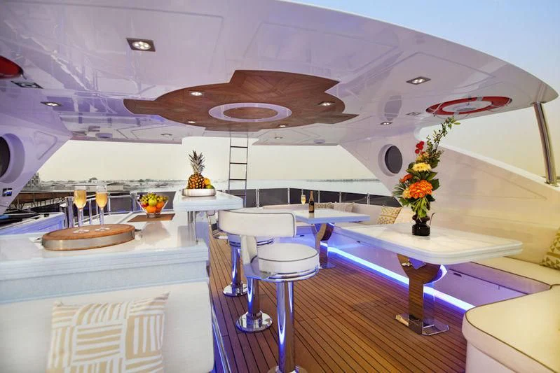 a room with a table and chairs aboard GRAND CRU Yacht for Sale