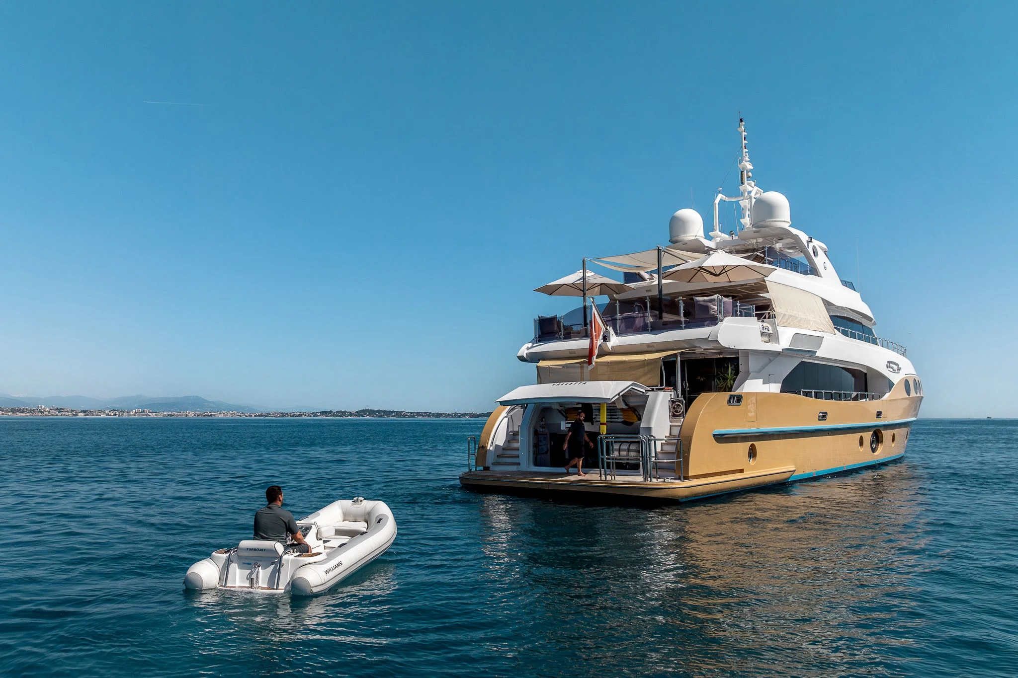 a boat and a boat in the water aboard GRAND CRU Yacht for Sale