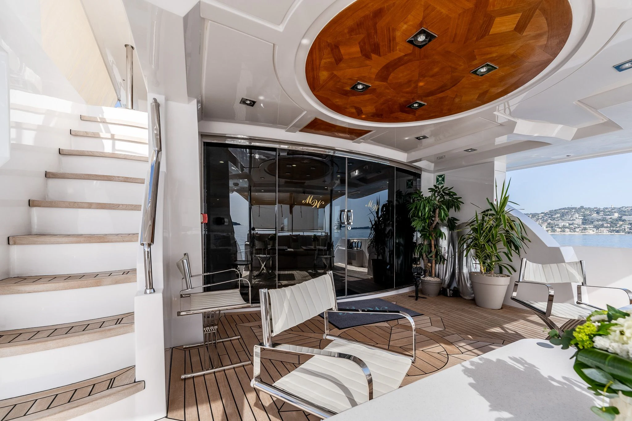 a room with a large window and a staircase aboard GRAND CRU Yacht for Sale