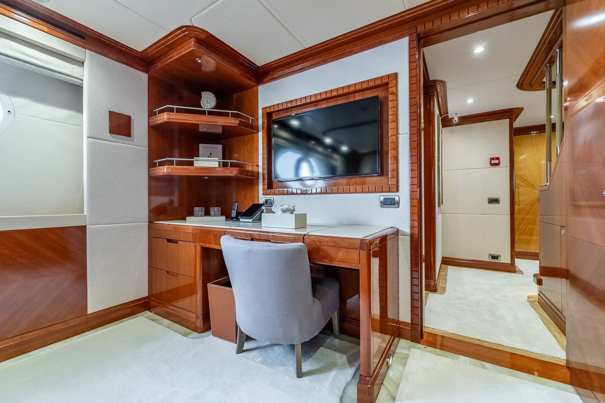 a room with a desk and a tv aboard GRAND CRU Yacht for Sale