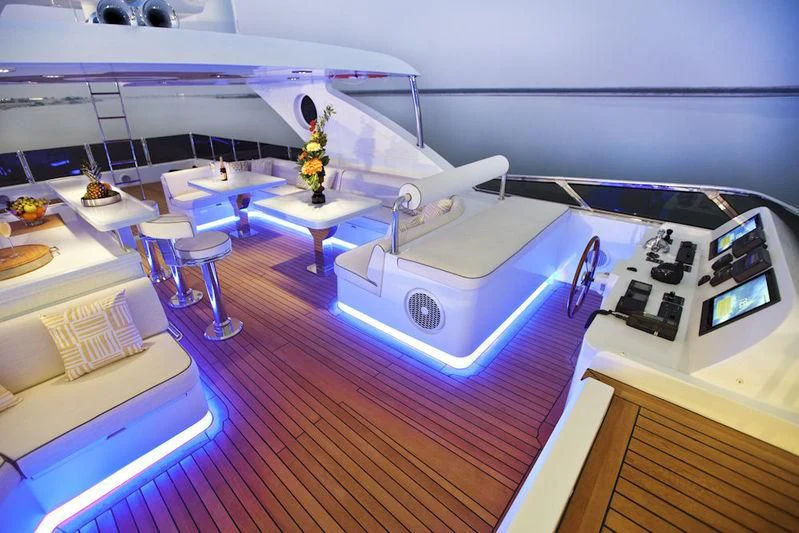 a room with a table and chairs aboard GRAND CRU Yacht for Sale