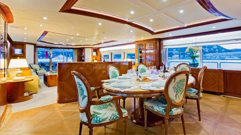 a dining room with a table and chairs aboard GRAND CRU Yacht for Sale