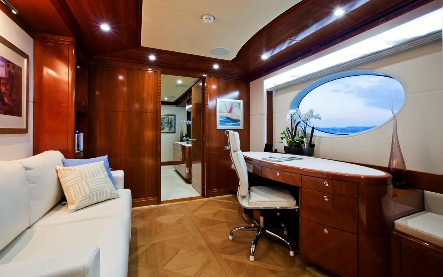 a room with a desk and a bed aboard GRAND CRU Yacht for Sale