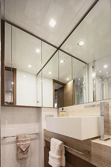 a bathroom with a large mirror aboard TOP SHELF Yacht for Sale