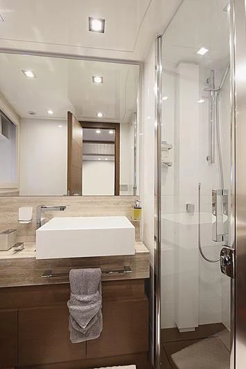 a bathroom with a large mirror aboard TOP SHELF Yacht for Sale