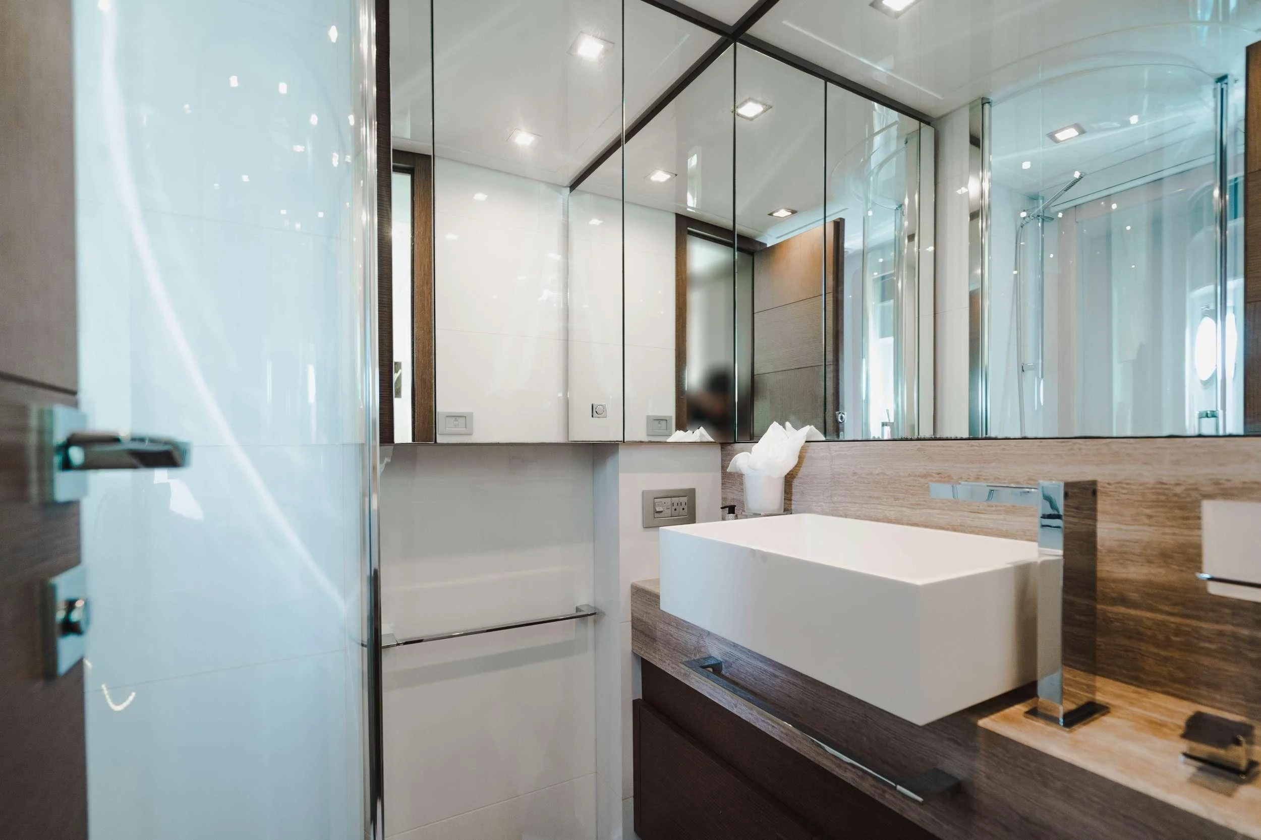 a bathroom with a large mirror aboard TOP SHELF Yacht for Sale