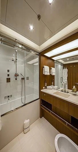 a bathroom with a large mirror aboard TOP SHELF Yacht for Sale