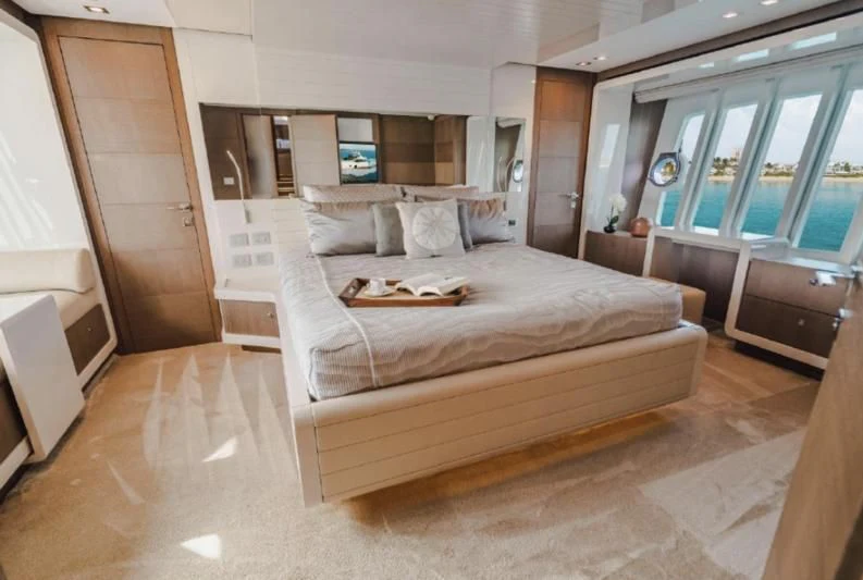 a large bed in a room aboard TOP SHELF Yacht for Sale