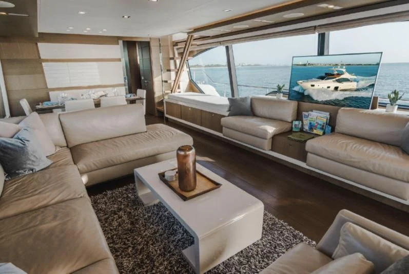 a living room with a large swimming pool aboard TOP SHELF Yacht for Sale