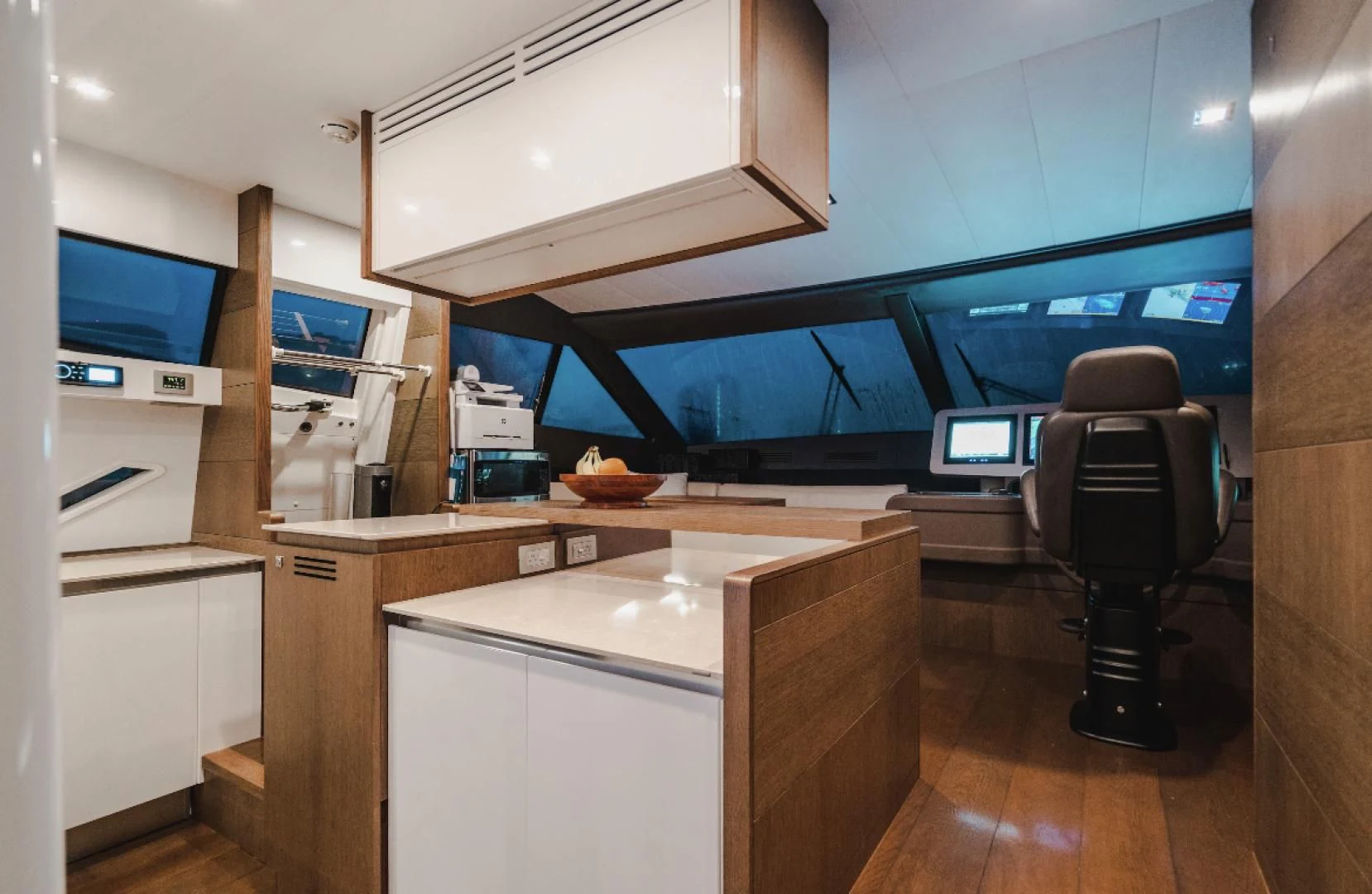a room with a desk and a tv aboard TOP SHELF Yacht for Sale