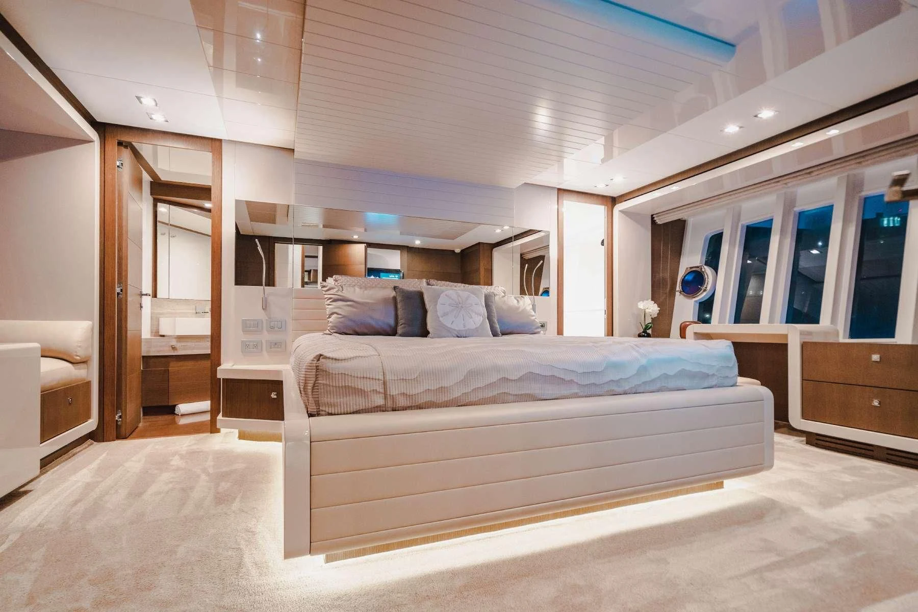 a large bedroom with a large bed aboard TOP SHELF Yacht for Sale
