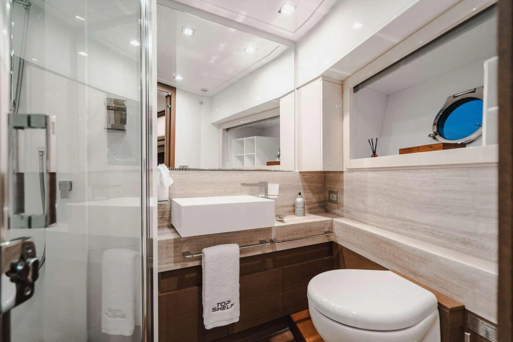 a bathroom with a large mirror aboard TOP SHELF Yacht for Sale