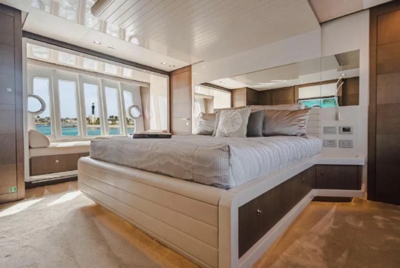 a bedroom with a bed aboard TOP SHELF Yacht for Sale