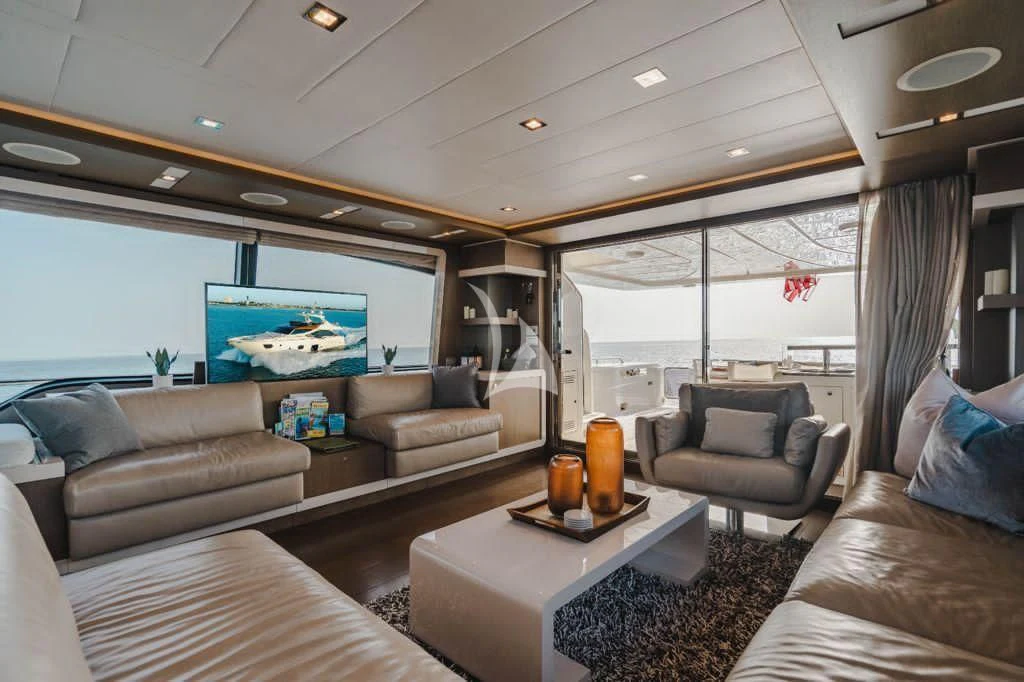a living room with a large window aboard TOP SHELF Yacht for Sale