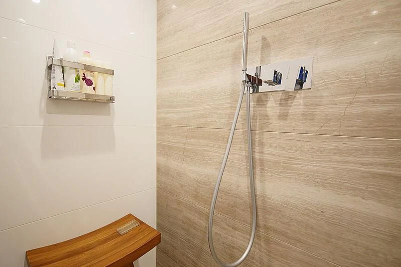 a shower unit with a shelf aboard TOP SHELF Yacht for Sale