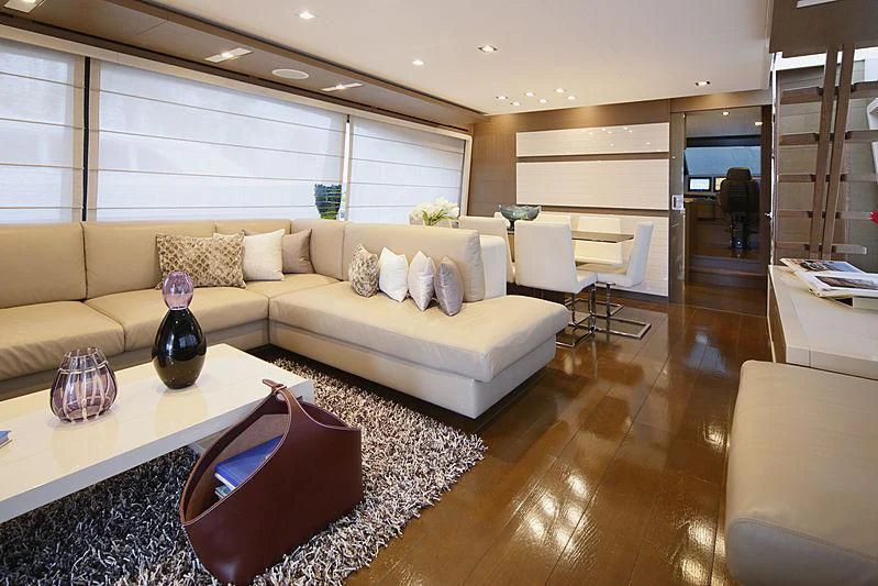 a living room with a large window aboard TOP SHELF Yacht for Sale