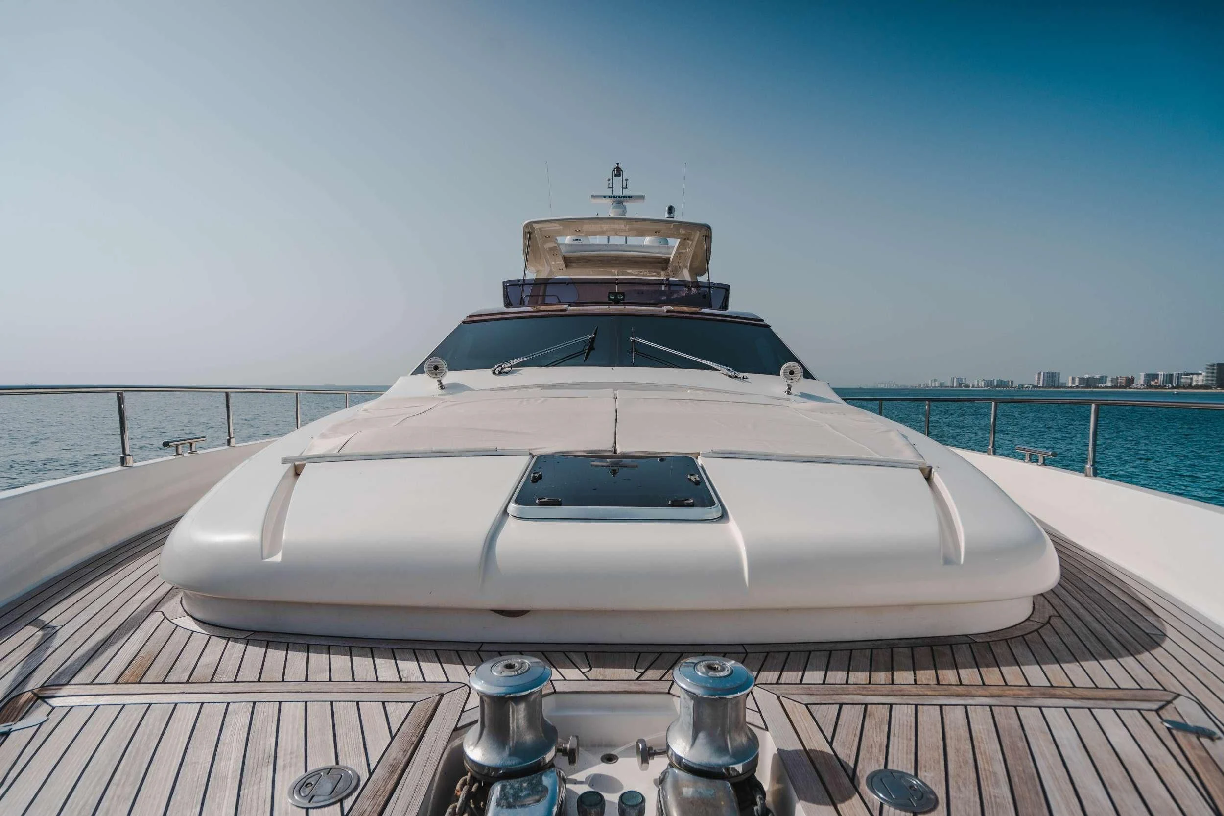 a white car on a wooden deck aboard TOP SHELF Yacht for Sale