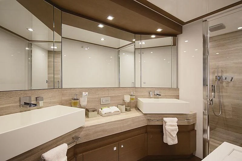 a bathroom with a large mirror aboard TOP SHELF Yacht for Sale