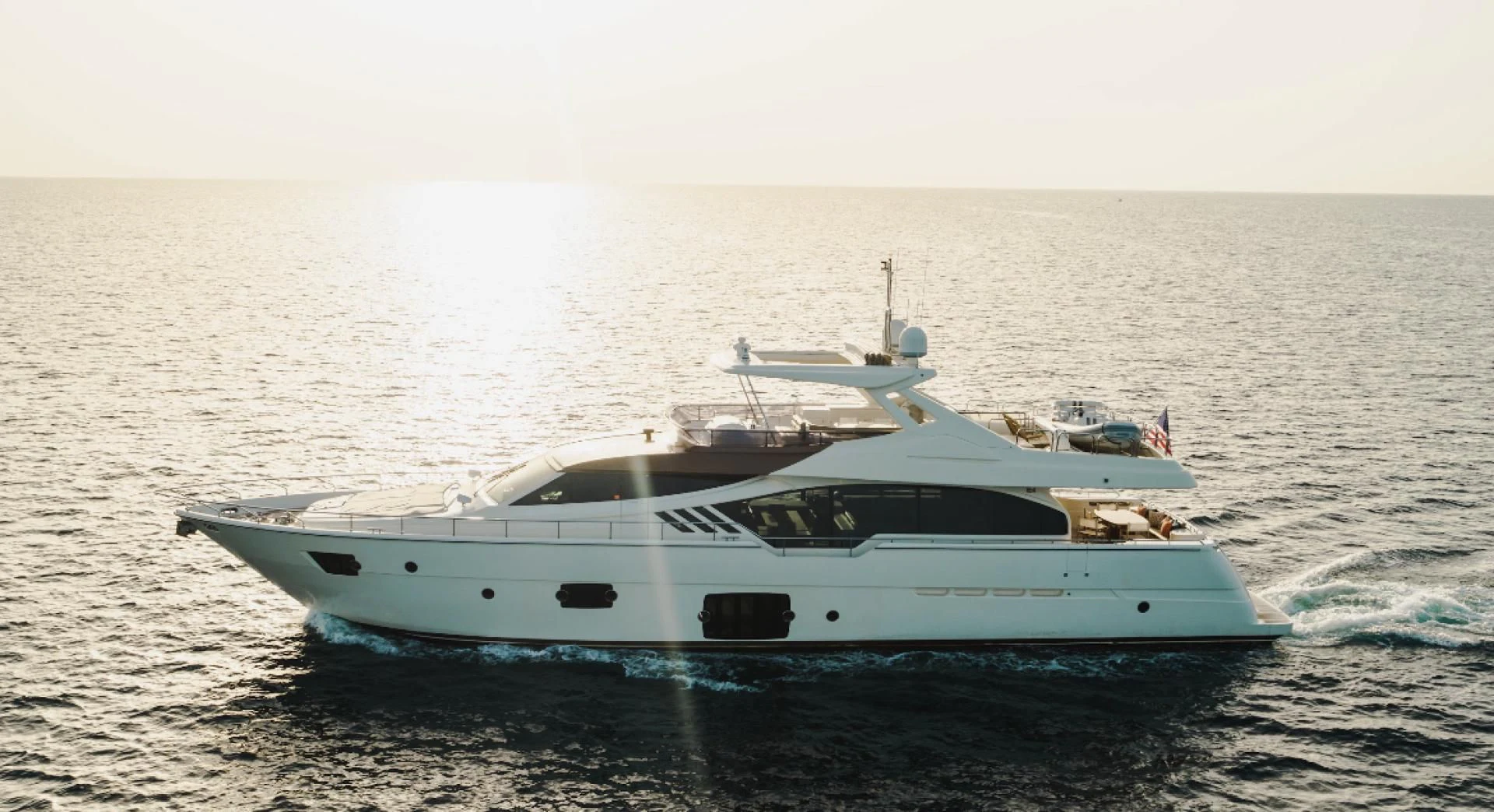 a white yacht on the water aboard TOP SHELF Yacht for Sale