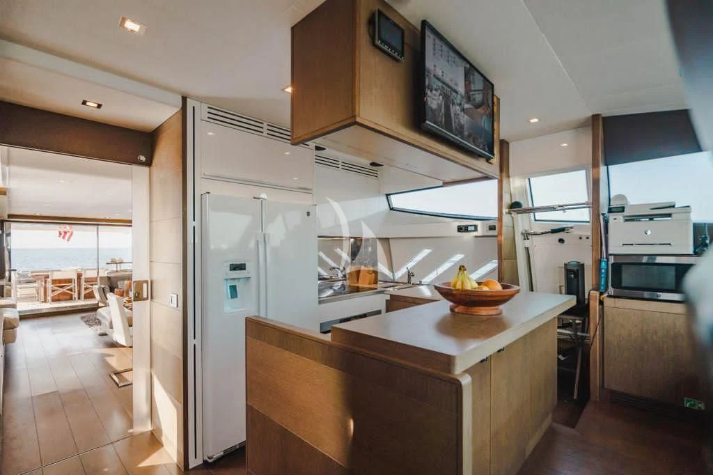 a kitchen with a bowl of fruit aboard TOP SHELF Yacht for Sale