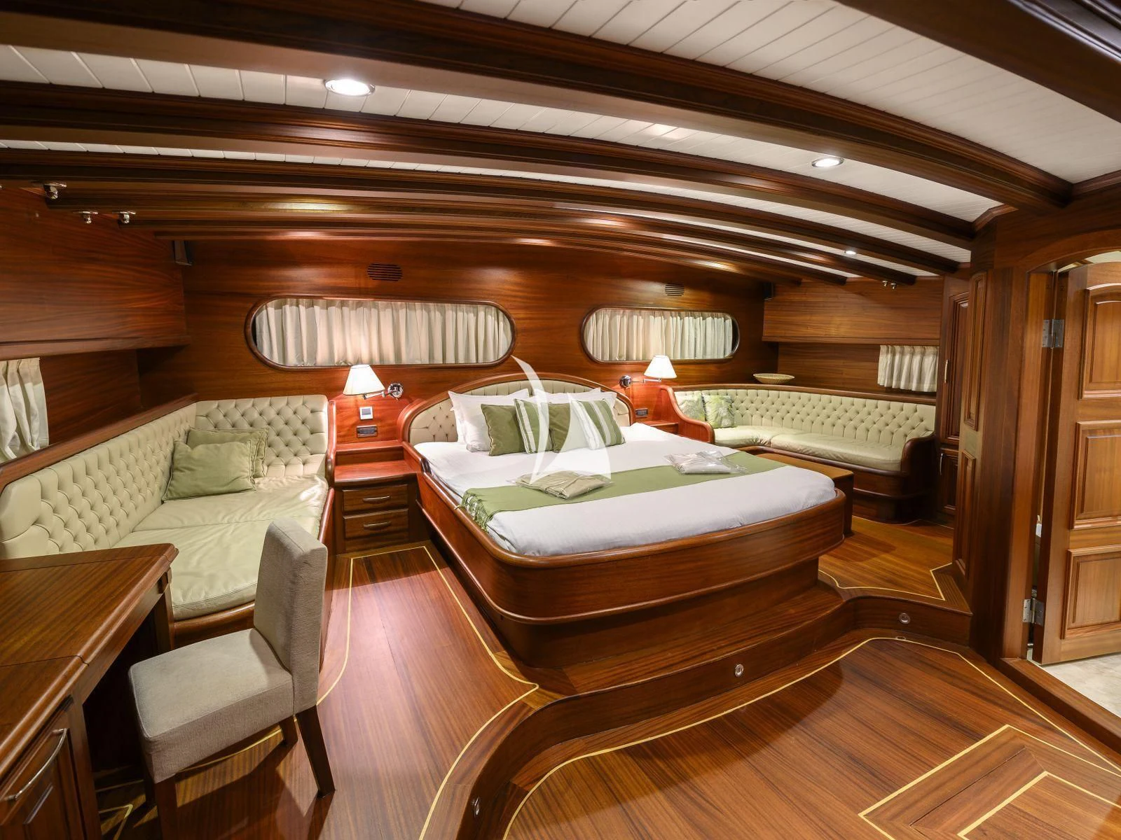 a room with a bed and a couch aboard CANER IV Yacht for Sale