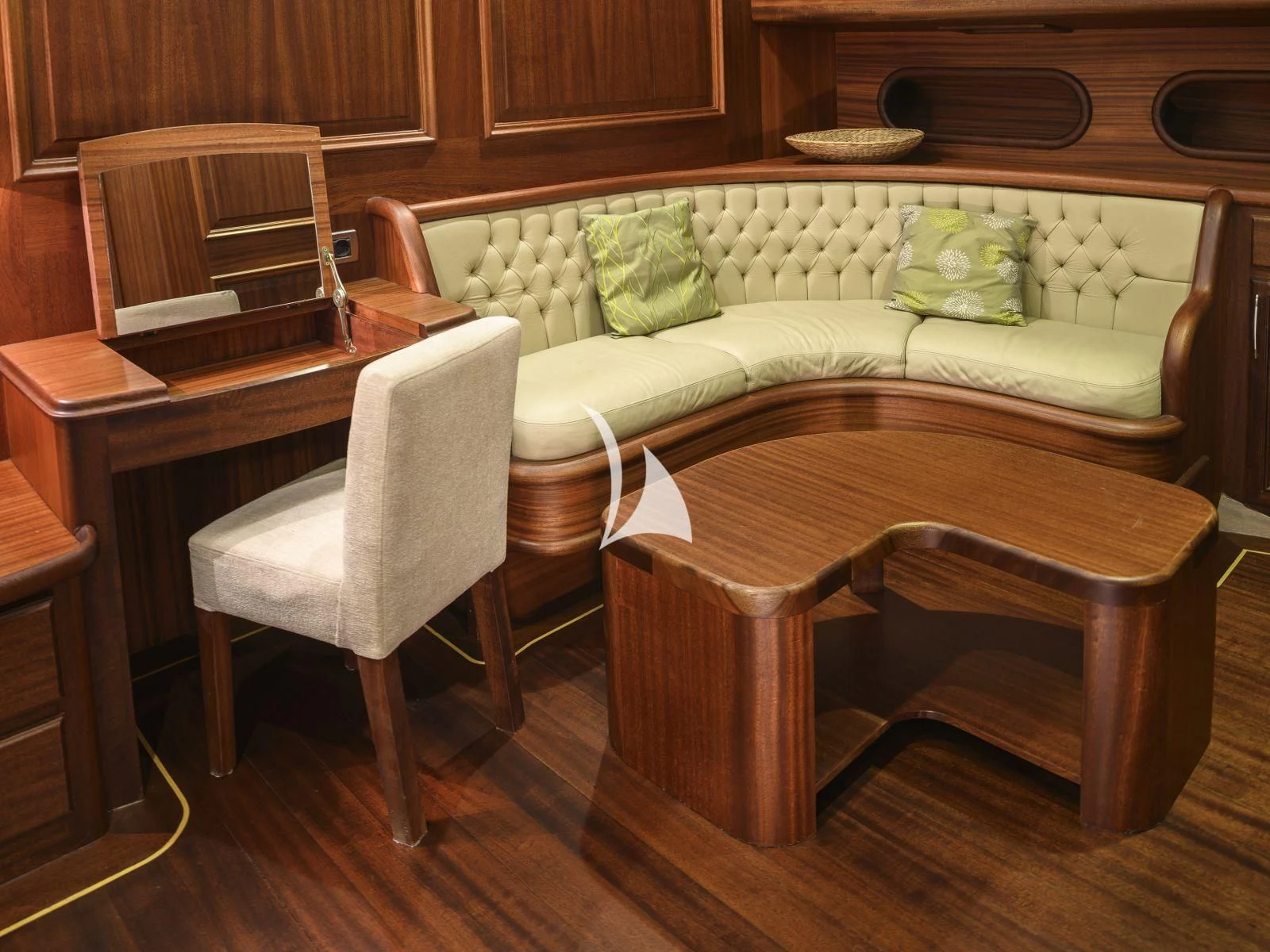 a couch and a table in a room aboard CANER IV Yacht for Sale
