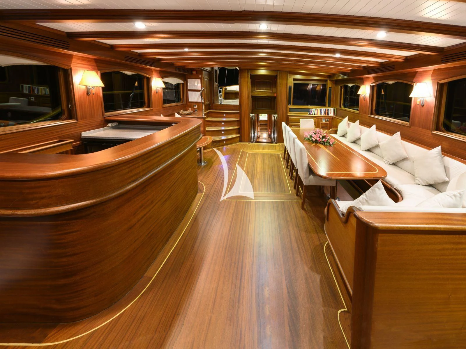 a large room with wooden floors aboard CANER IV Yacht for Sale
