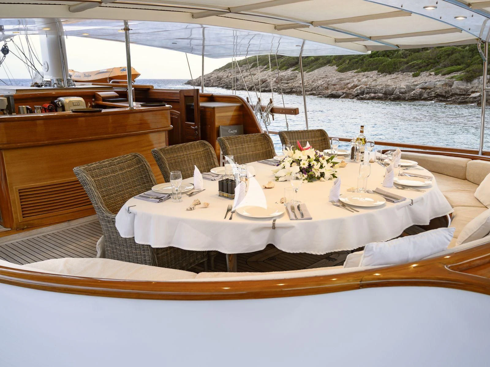a table set for a dinner aboard CANER IV Yacht for Sale