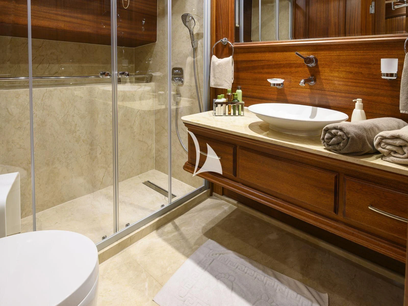 a bathroom with a glass shower aboard CANER IV Yacht for Sale