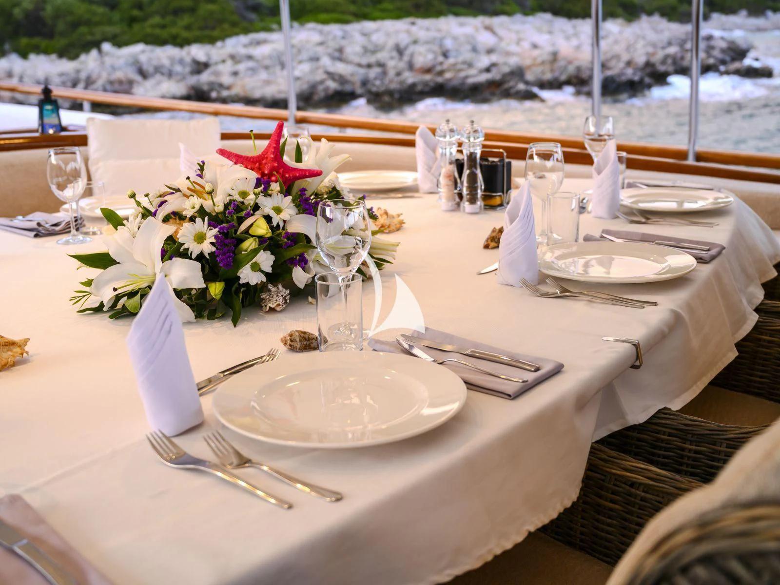 a table set with place settings aboard CANER IV Yacht for Sale