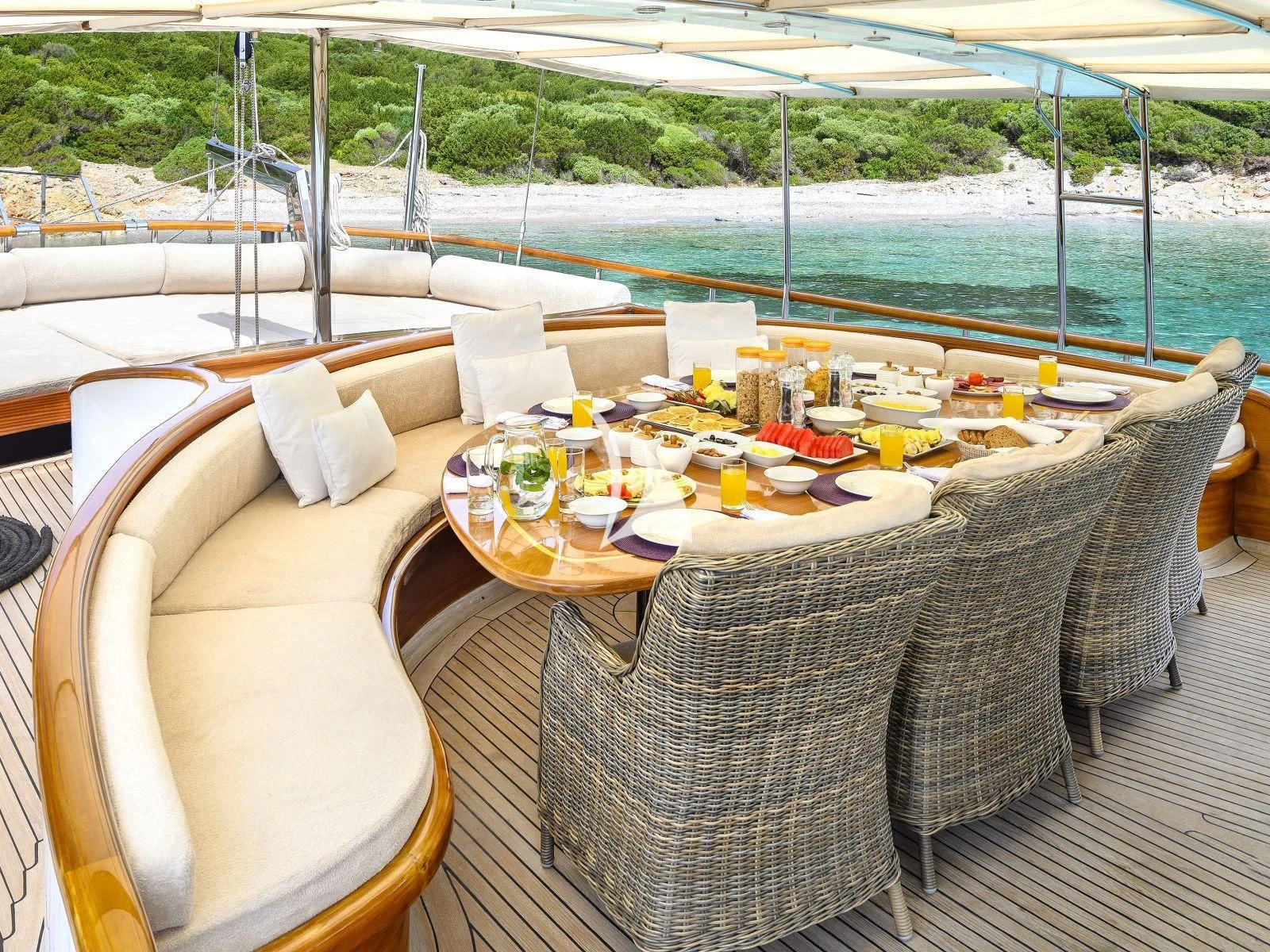 a table set for a meal on a deck aboard CANER IV Yacht for Sale