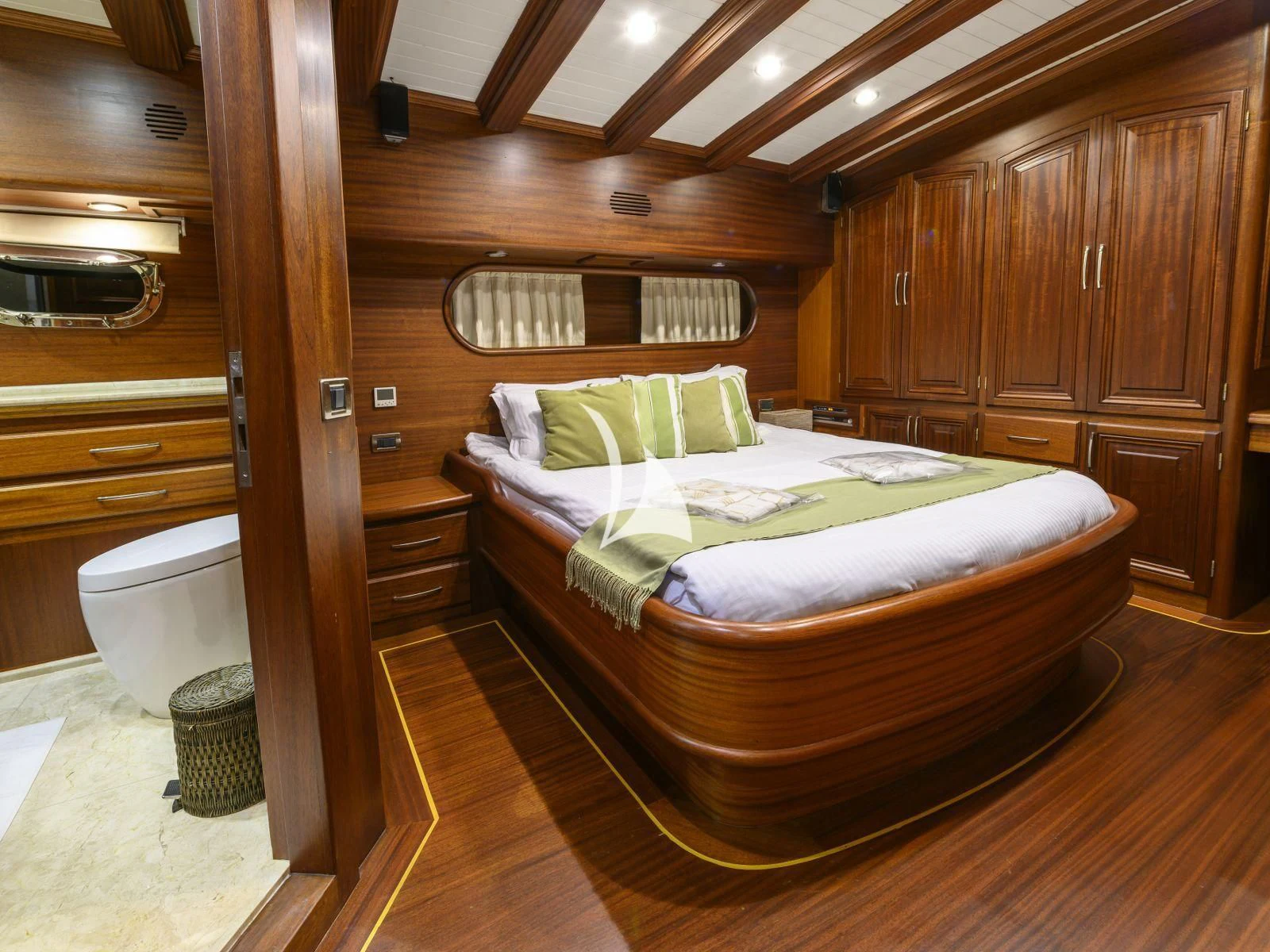 a bed in a wooden room aboard CANER IV Yacht for Sale