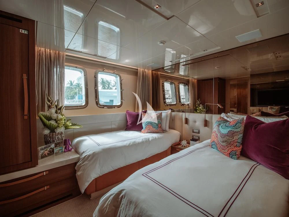 a couple of beds in a room aboard FIFTY SHADES Yacht for Sale