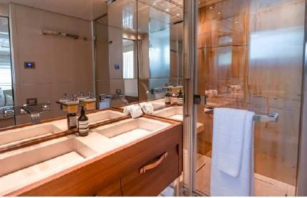 a bathroom with a large mirror aboard FIFTY SHADES Yacht for Sale