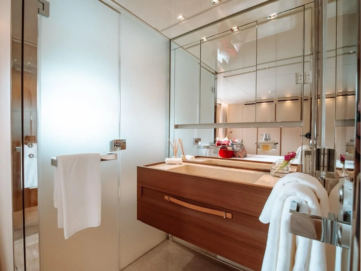 a bathroom with a sink and a mirror aboard FIFTY SHADES Yacht for Sale