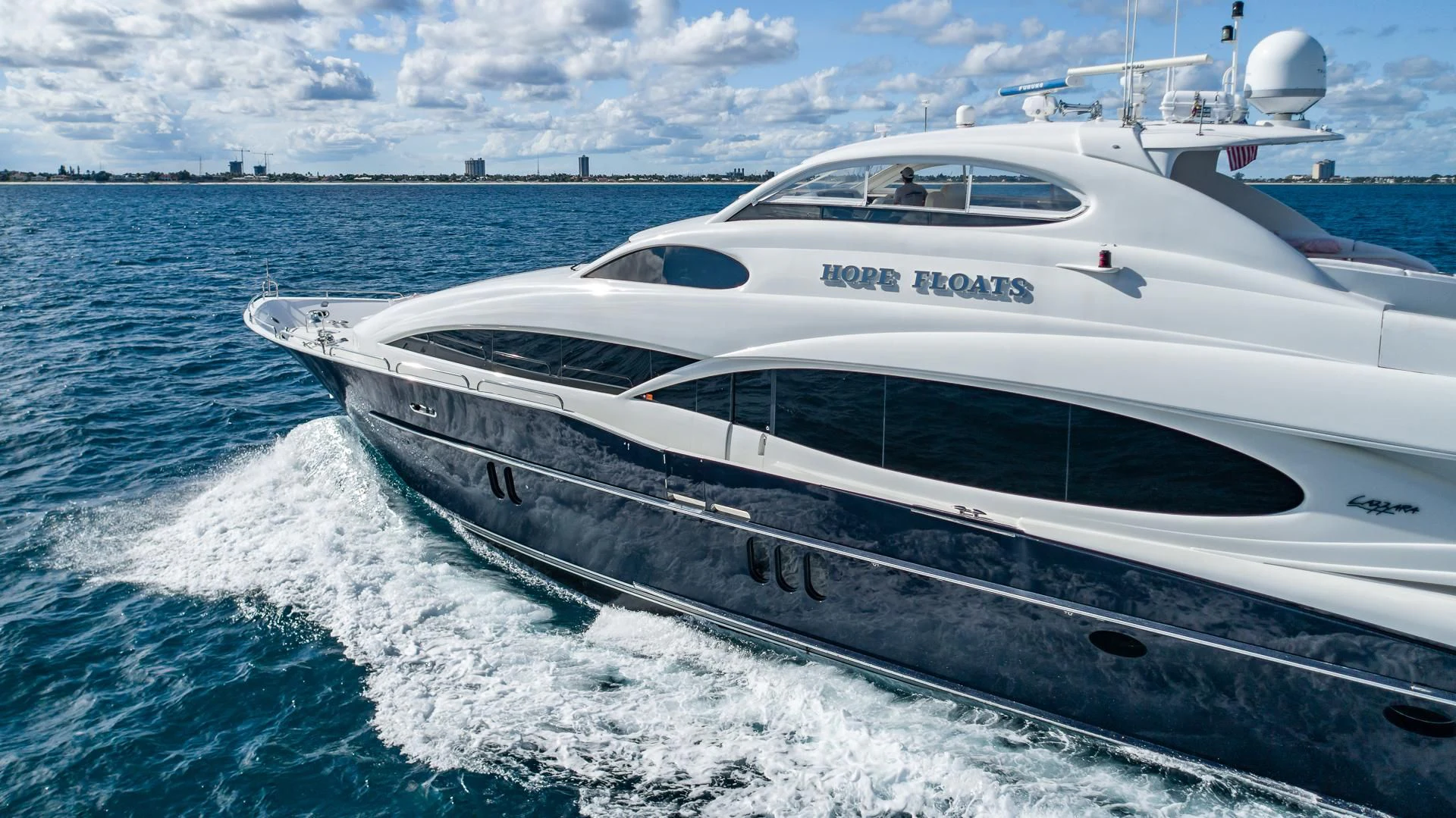 a white yacht on the water aboard HOPE FLOATS Yacht for Sale