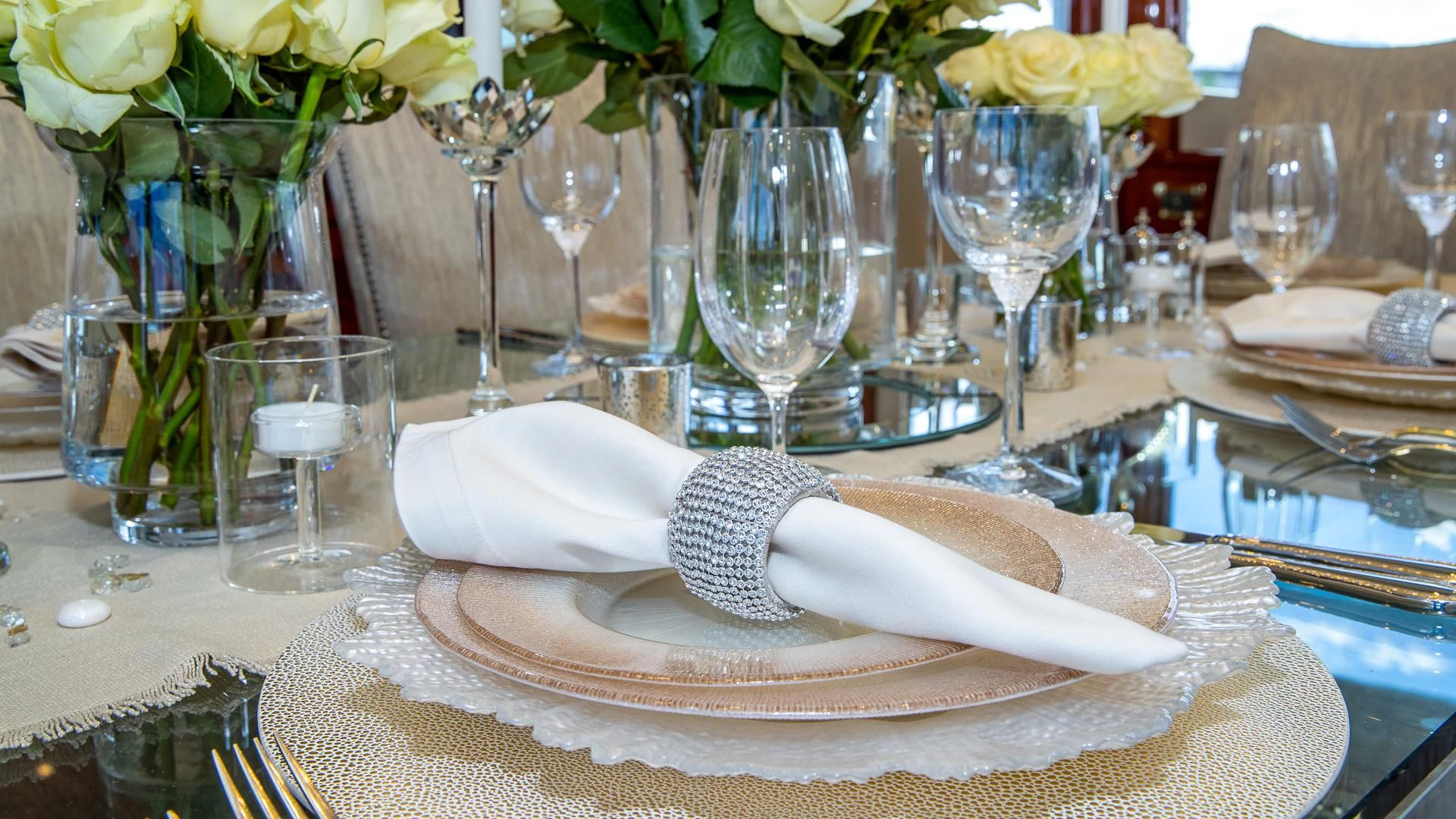 a white hat on a plate with glasses and a napkin aboard HOPE FLOATS Yacht for Sale