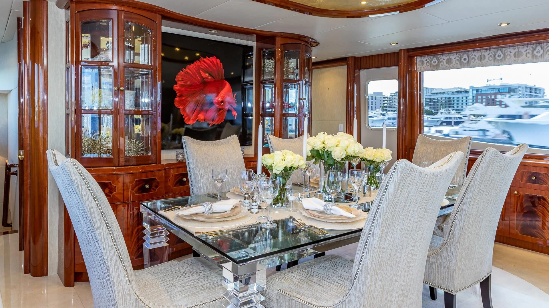 a dining room with a flower on the table aboard HOPE FLOATS Yacht for Sale