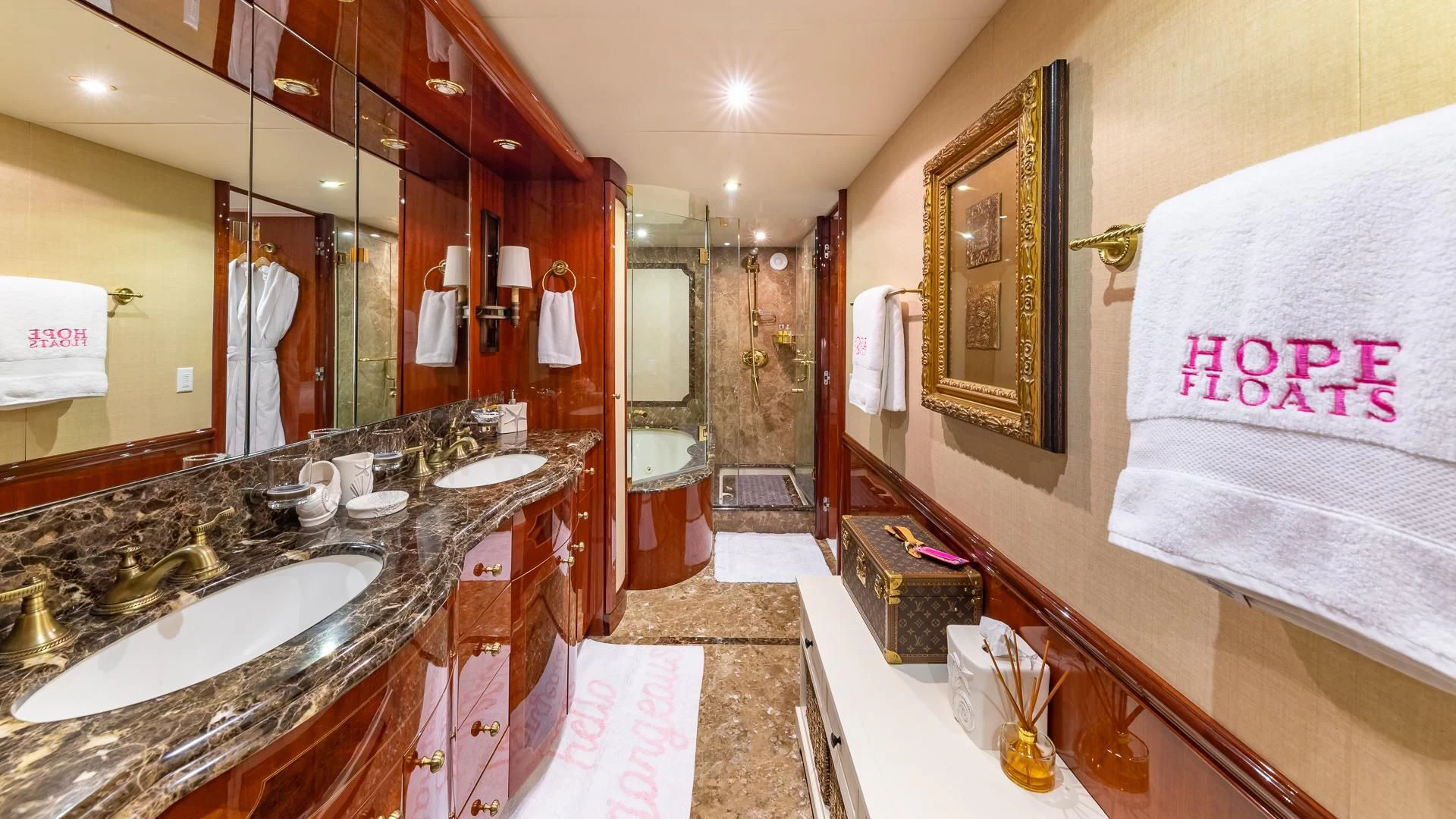 a bathroom with a large mirror aboard HOPE FLOATS Yacht for Sale