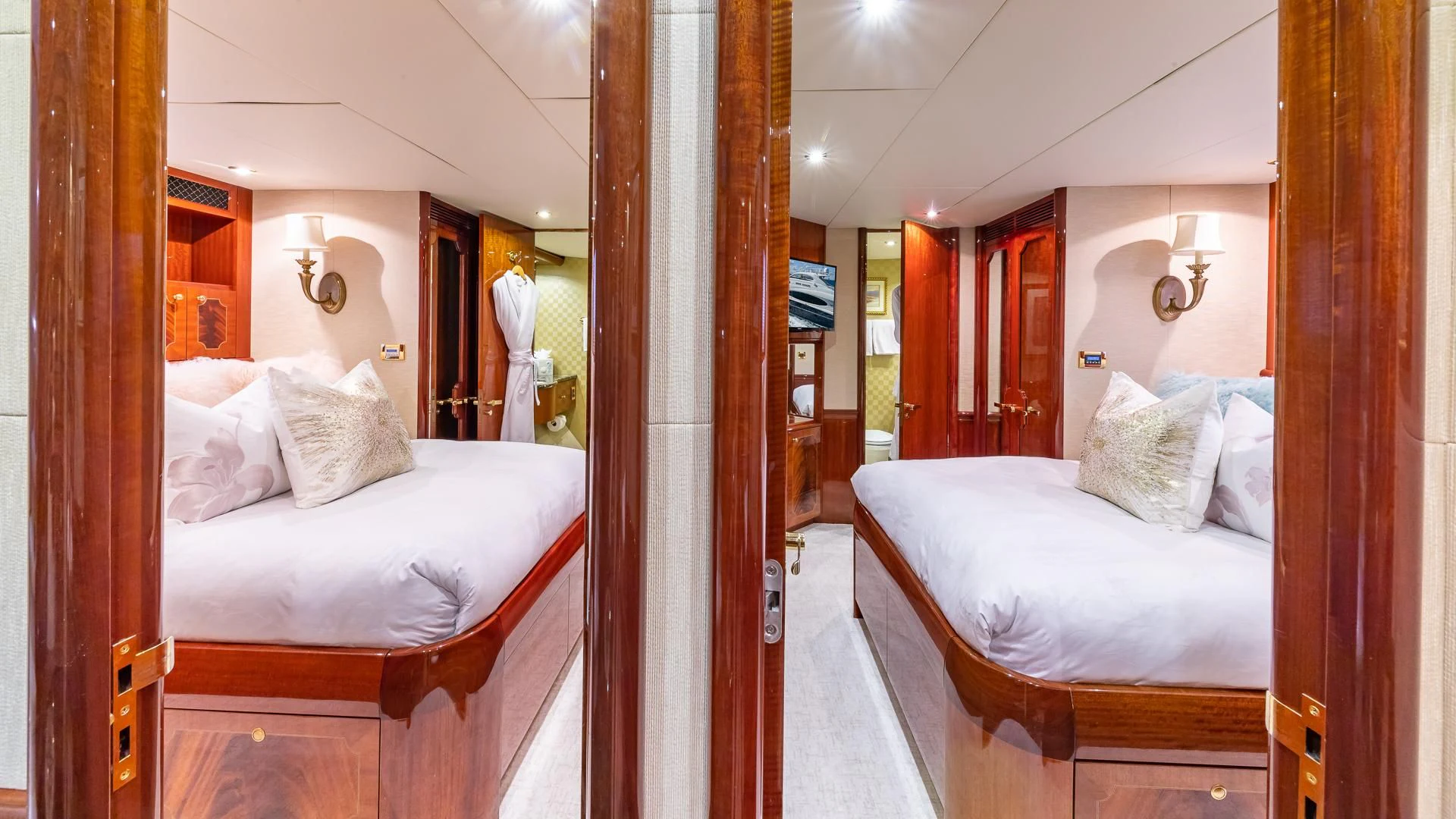 a room with a couple beds aboard HOPE FLOATS Yacht for Sale