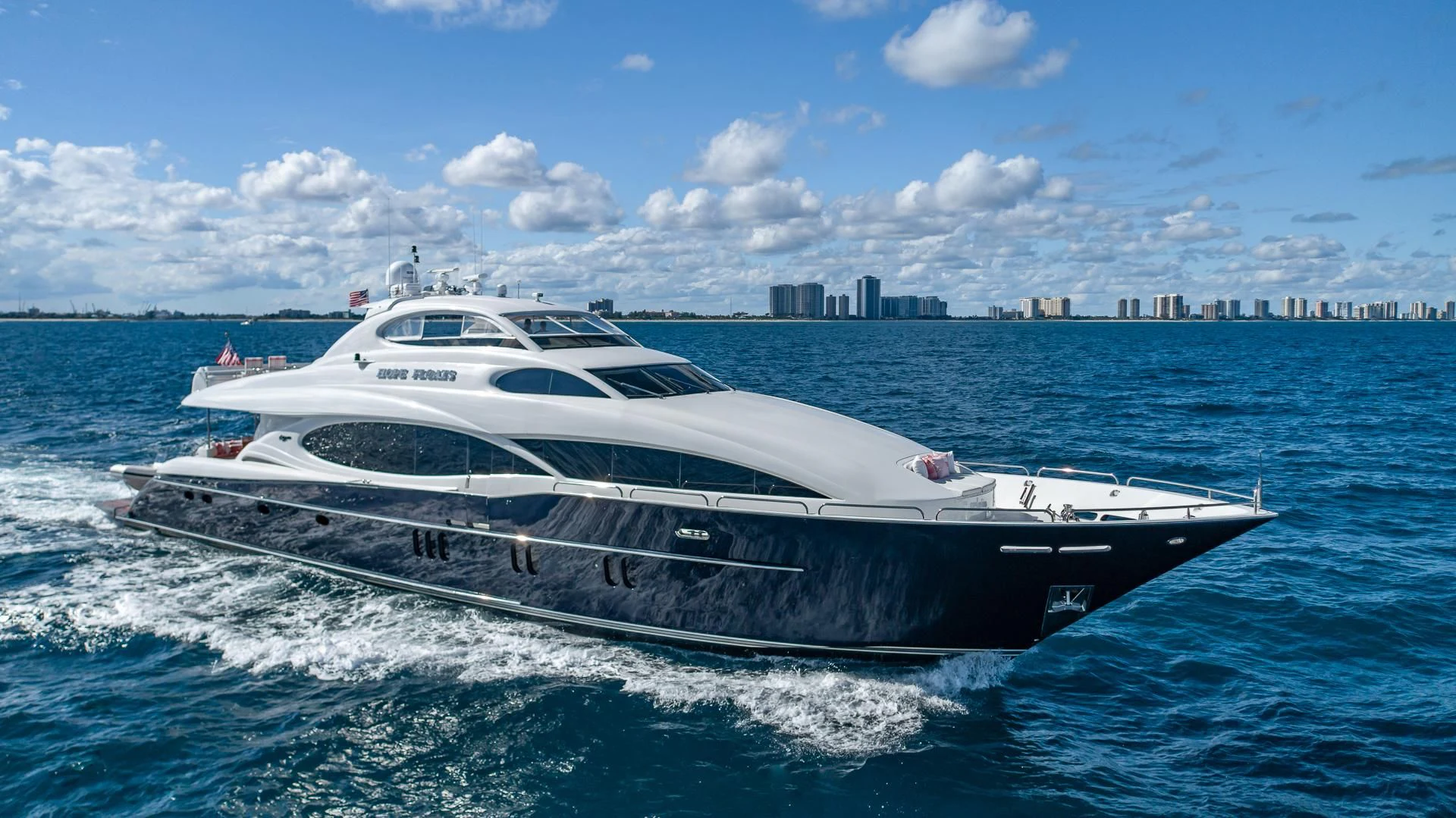 a white yacht on the water aboard HOPE FLOATS Yacht for Sale