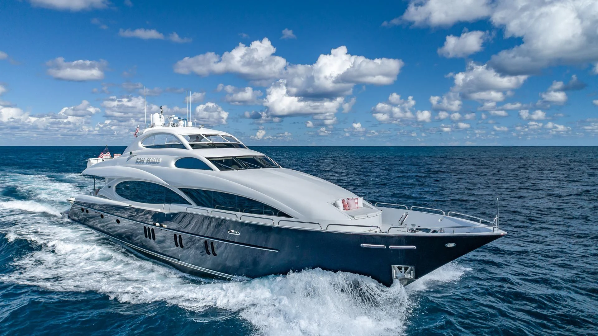 a white yacht on the water aboard HOPE FLOATS Yacht for Sale
