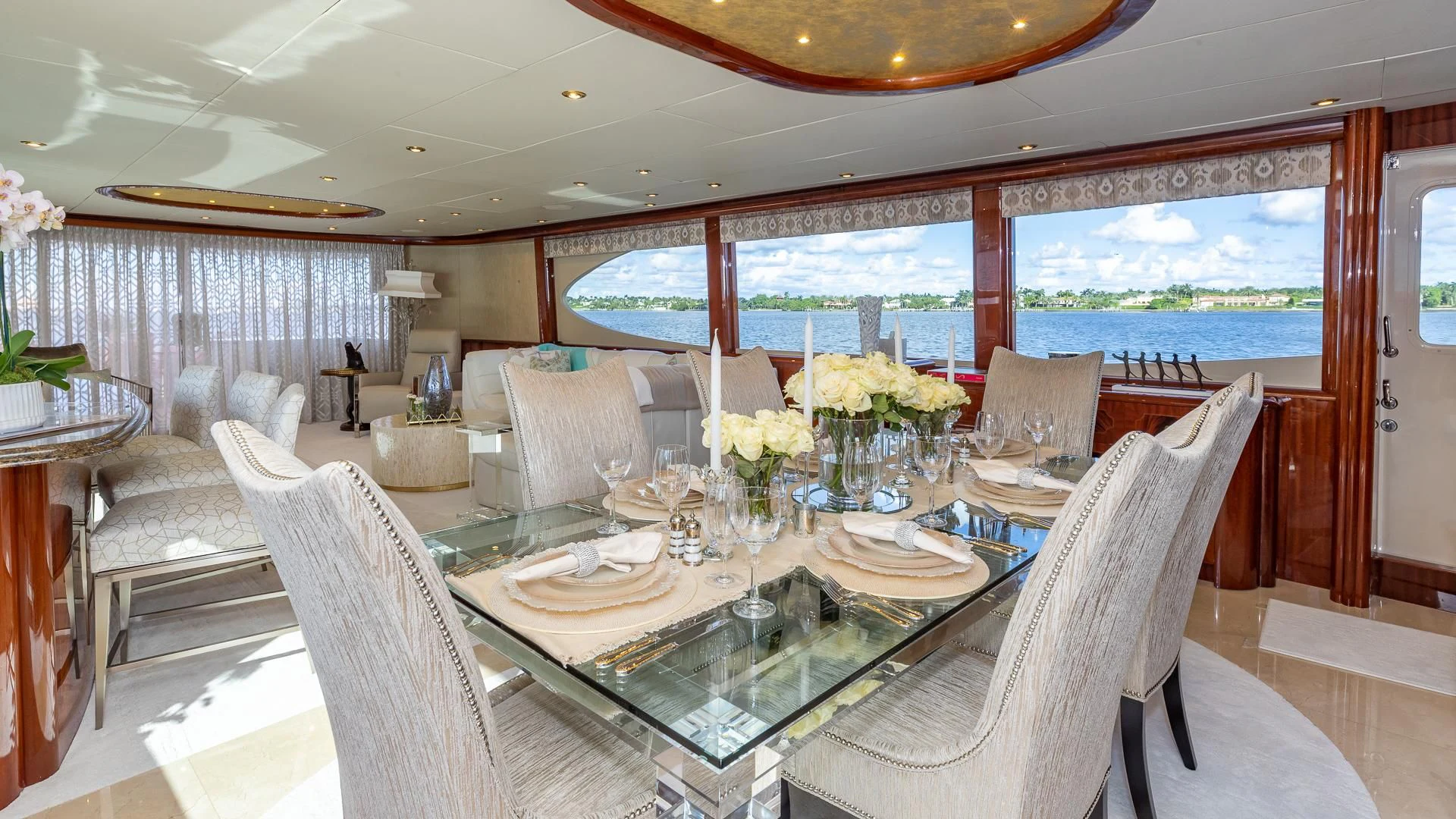 a dining room with a large window aboard HOPE FLOATS Yacht for Sale