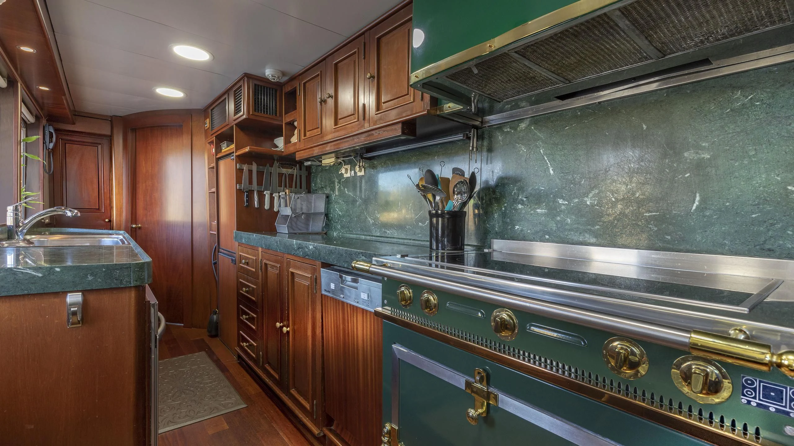 a kitchen with a large stove aboard MONTREVEL Yacht for Sale