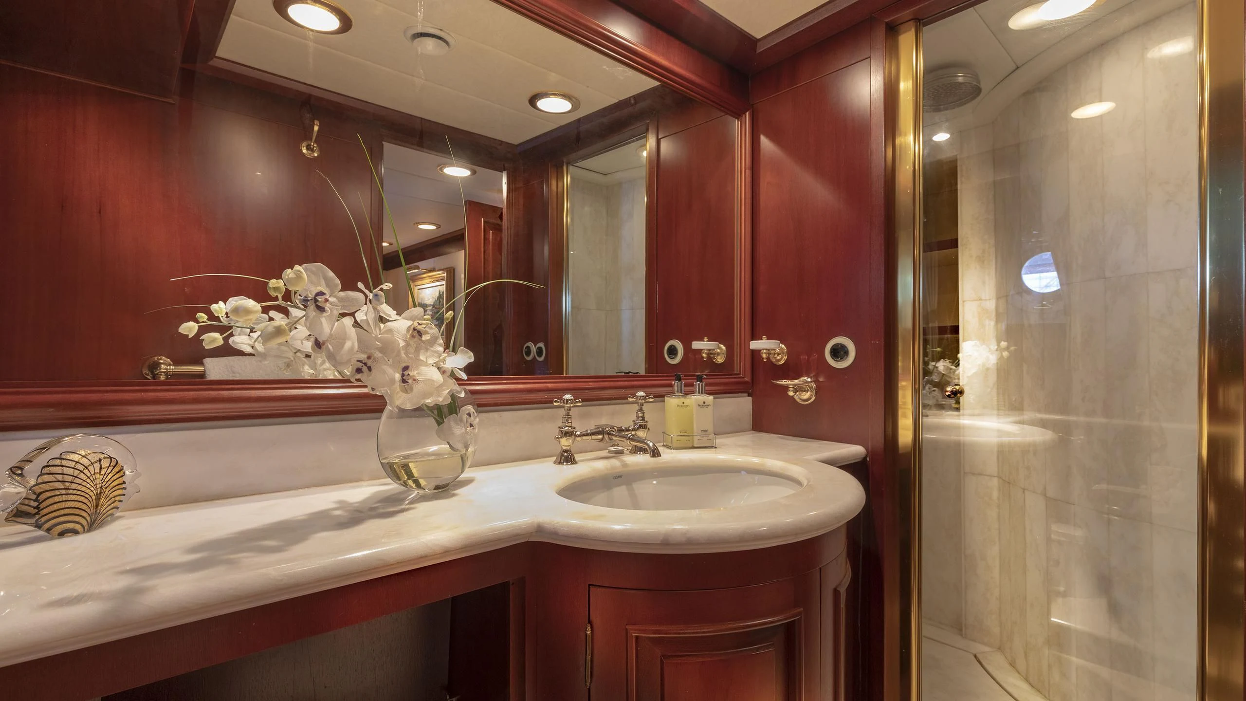 a bathroom with a large mirror aboard MONTREVEL Yacht for Sale
