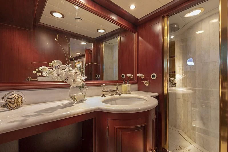 a bathroom with a large mirror aboard MONTREVEL Yacht for Sale