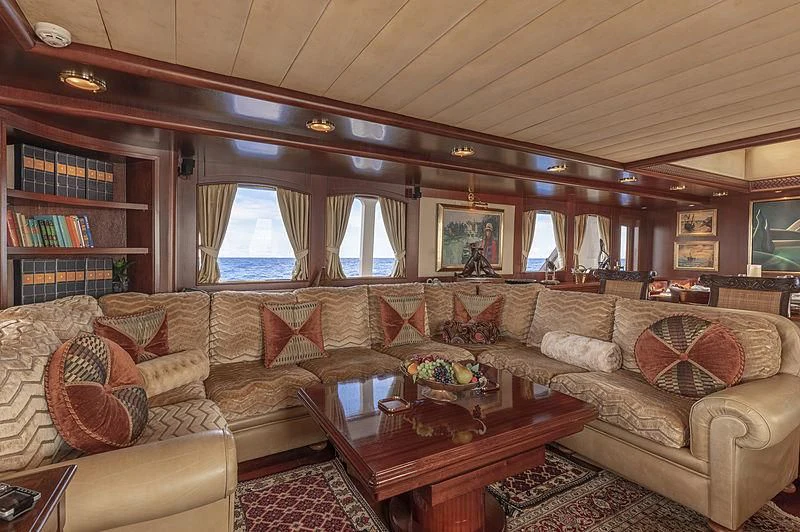 a living room with a couch and a coffee table aboard MONTREVEL Yacht for Sale