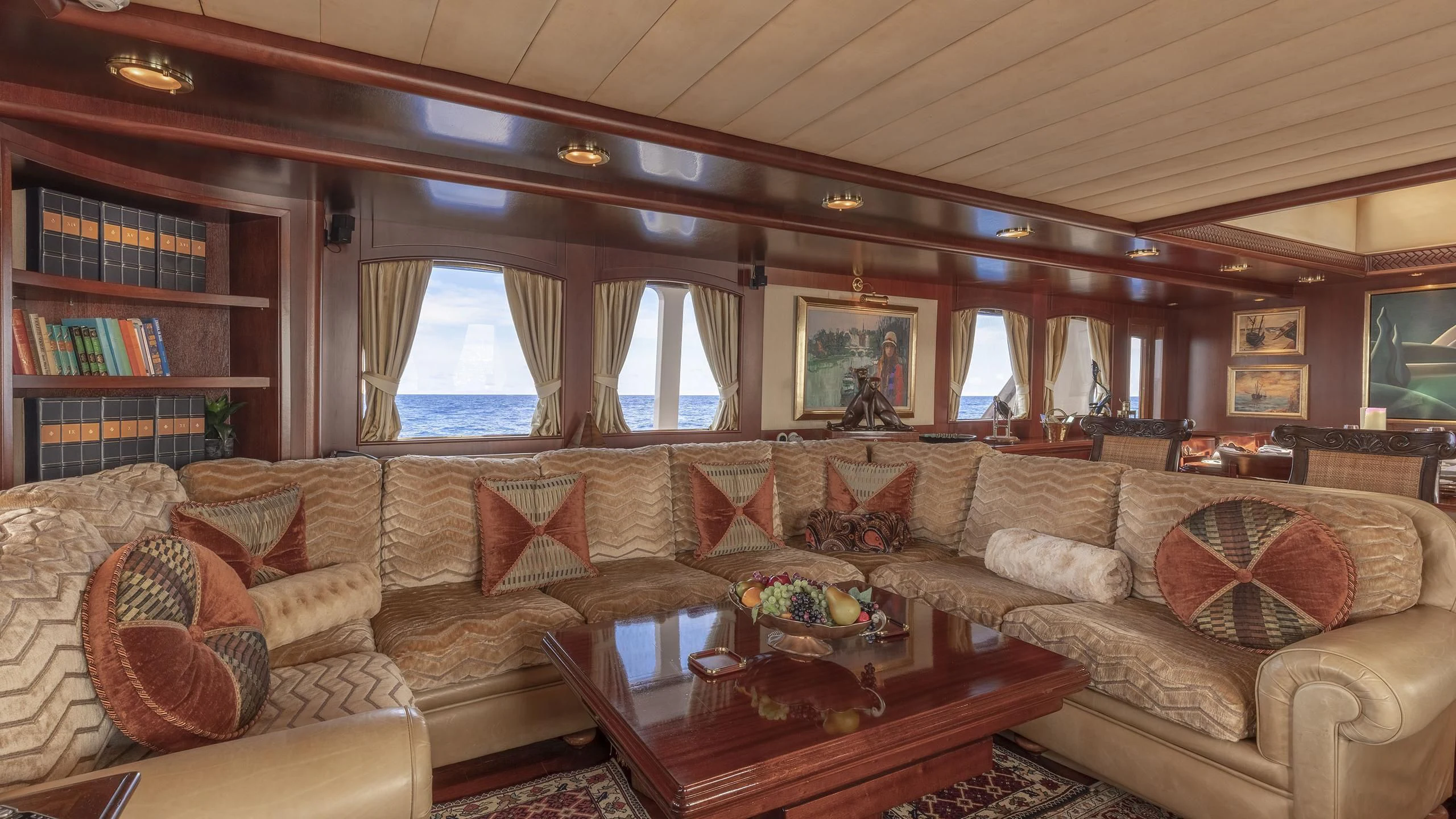 a living room with a couch and a coffee table aboard MONTREVEL Yacht for Sale