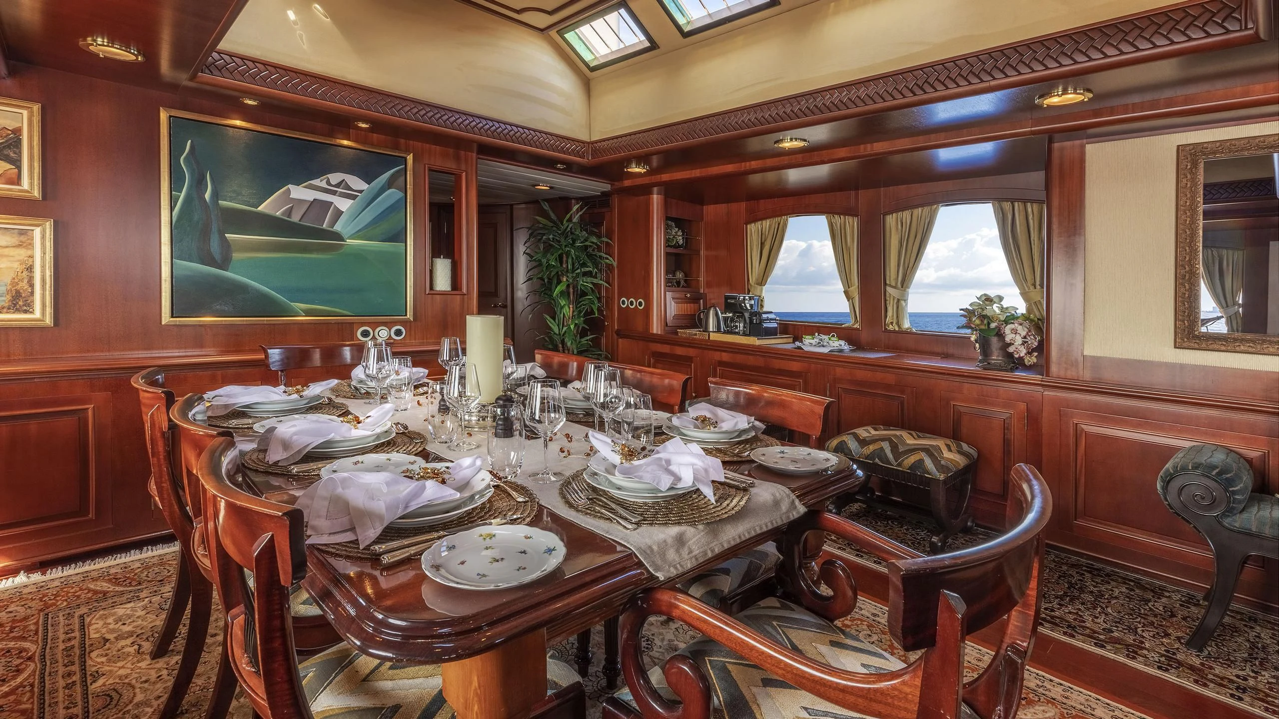 a dining room with a table and chairs aboard MONTREVEL Yacht for Sale